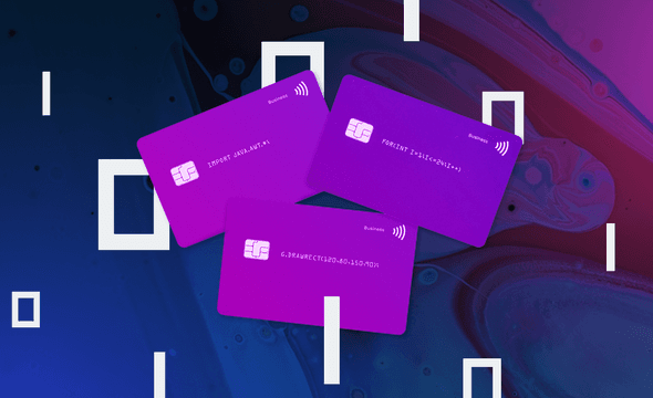 Credit cards with binary icons on neon background.