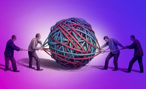 4 men untangling a giant rubber band ball