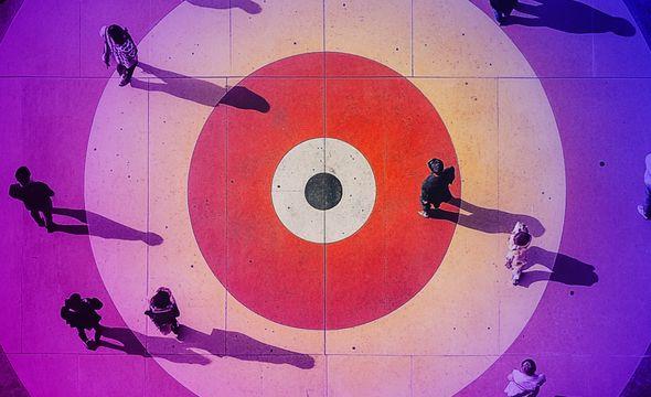 aerial view of a target with people walking across it