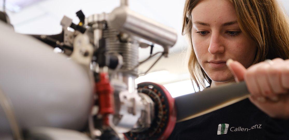 A female employee working on a rotor.