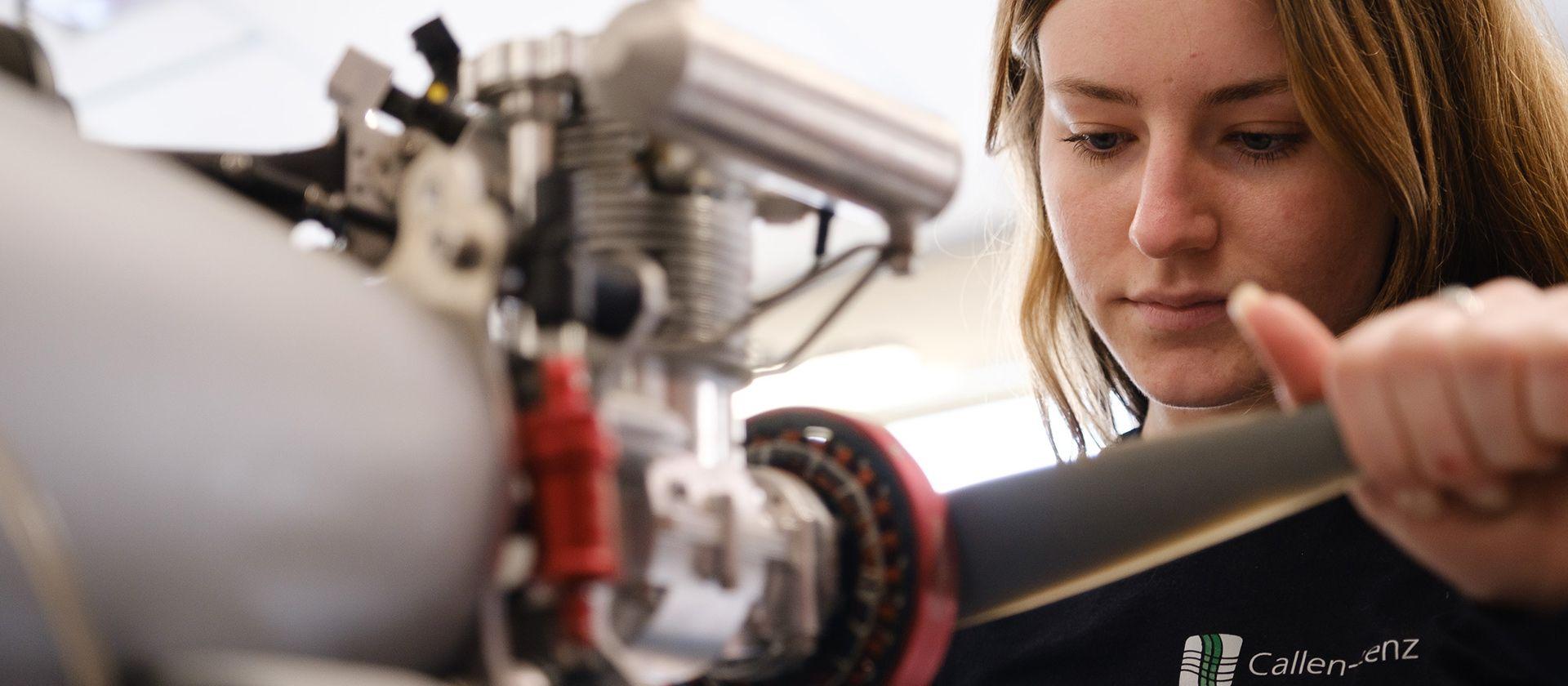 A female employee working on a rotor.