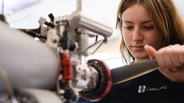 A female employee working on a rotor.
