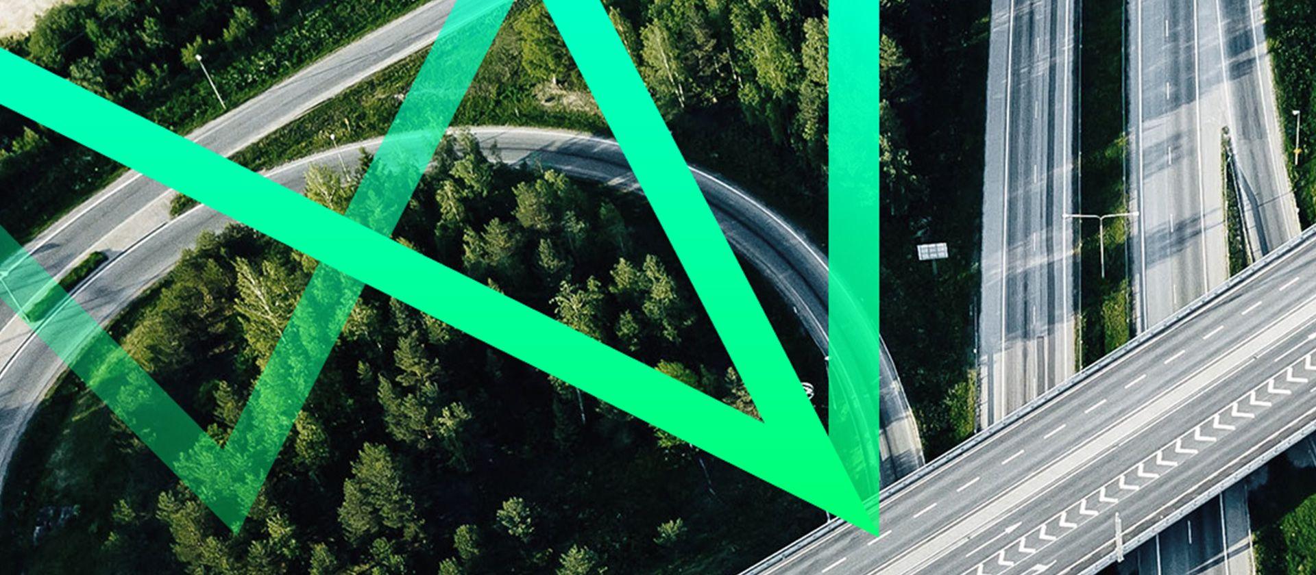 Birds-eye view of motorway with a green abstract graphic overlayed.