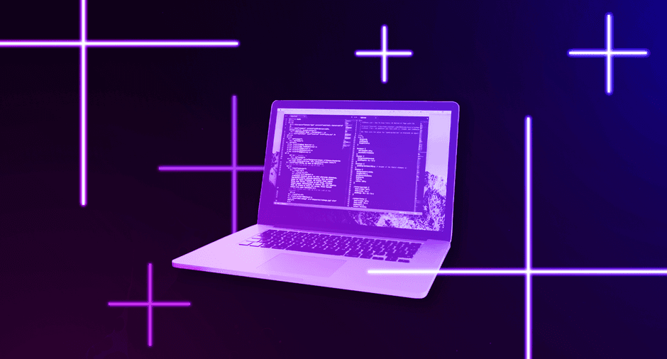 Laptop with code on screen on neon background.