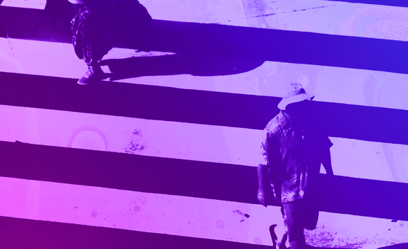Two people on a zebra crossing with blue to purple colour hue.